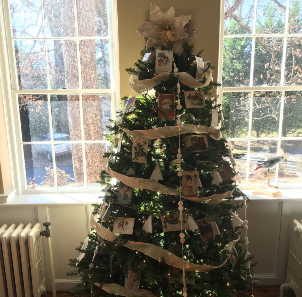 Decorated christmas tree with vintage postcards